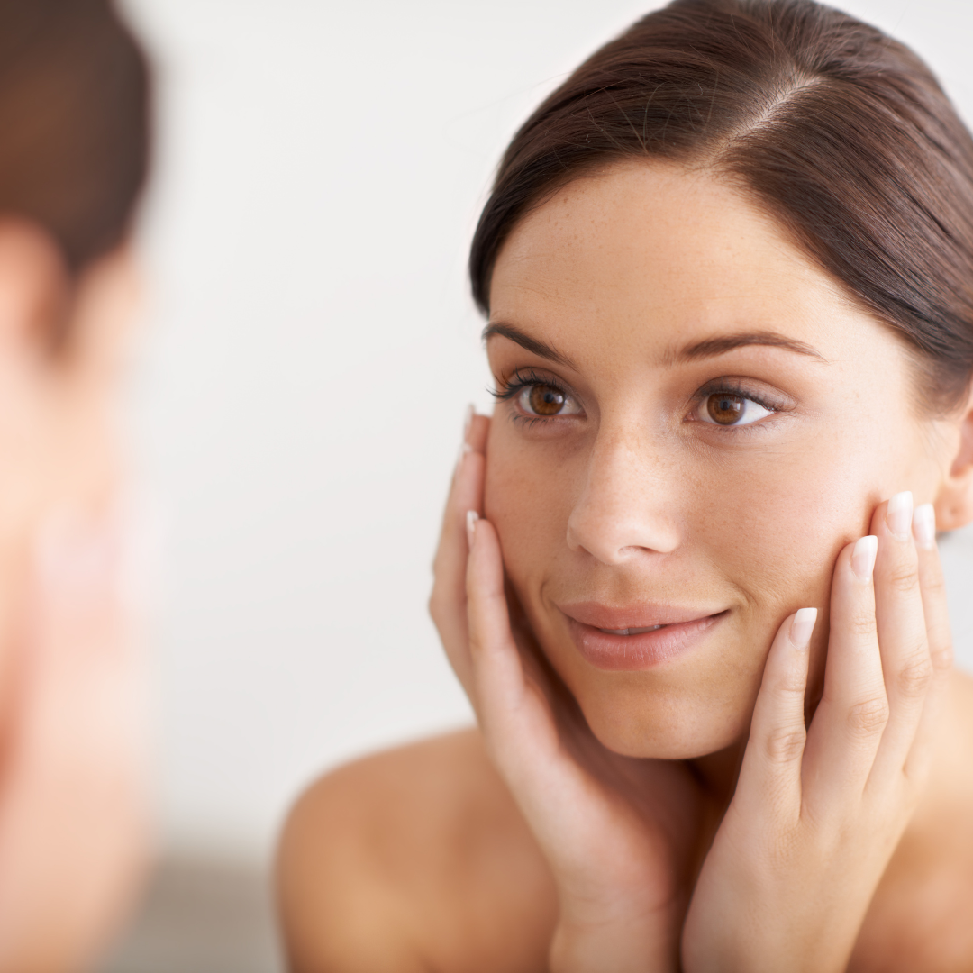 woman with hands on face 